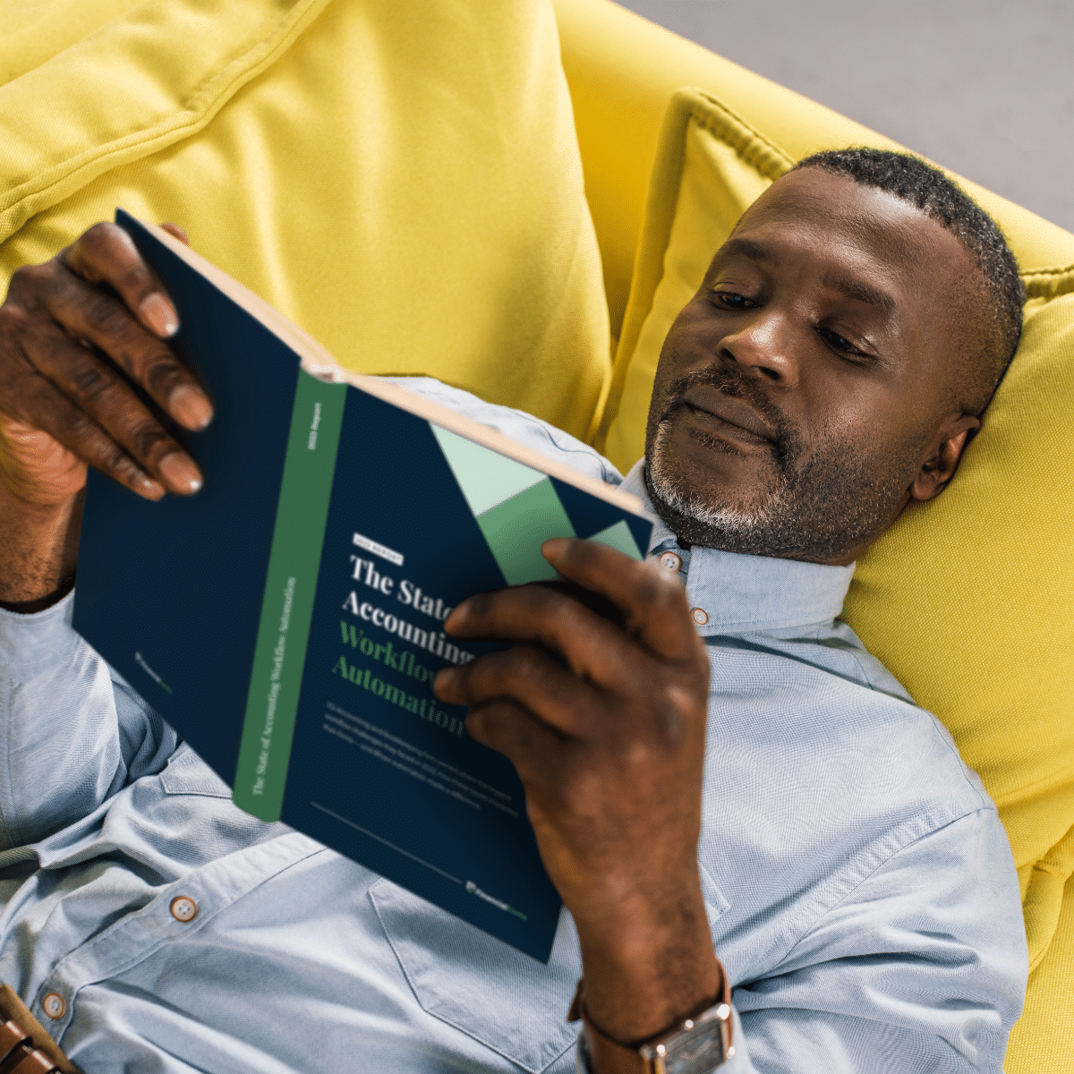 Man reading The State of Accounting Workflow Automation Report