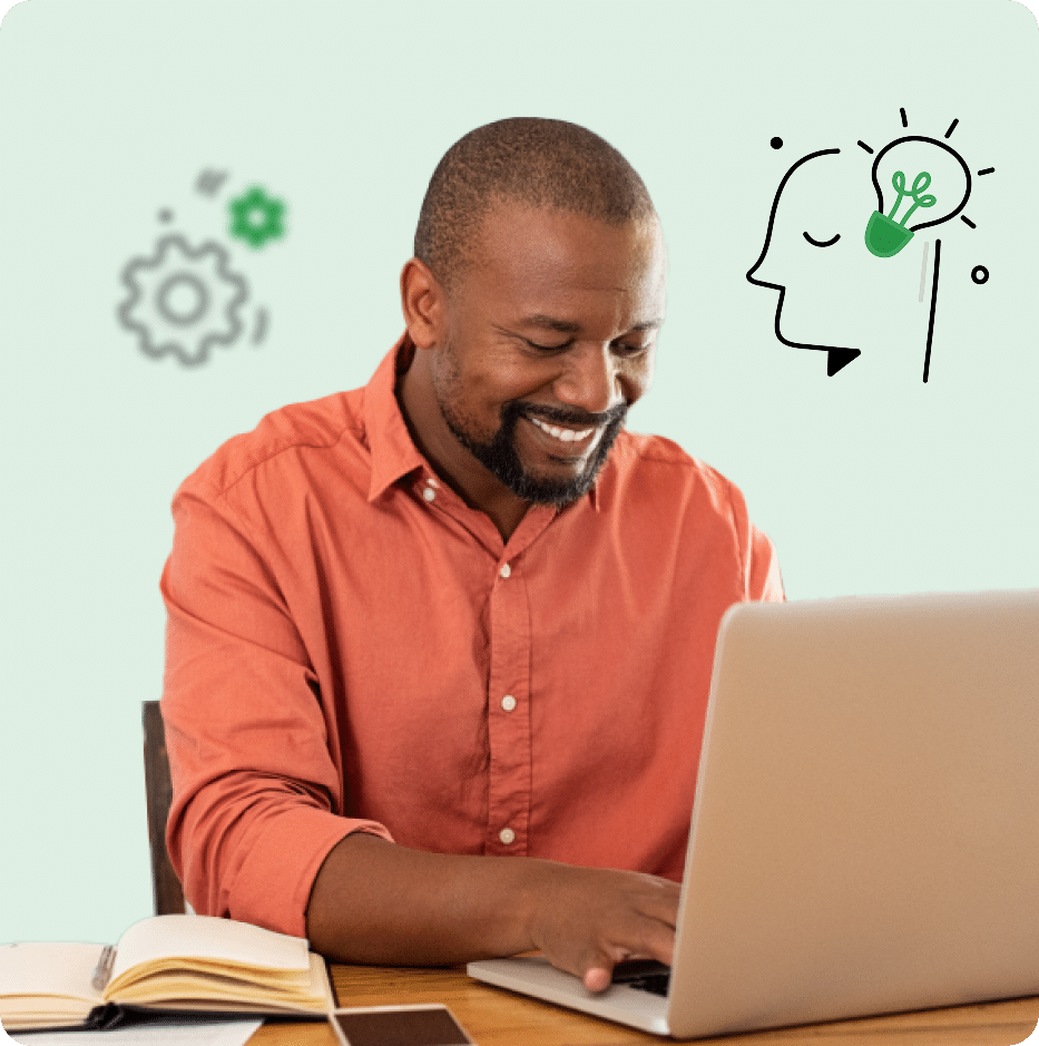 Accounting firm owner working on a laptop, smiling while handling tasks and improving workflows.