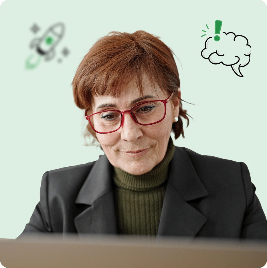 Practice owner focused on work at a laptop, reviewing information and managing operations online.